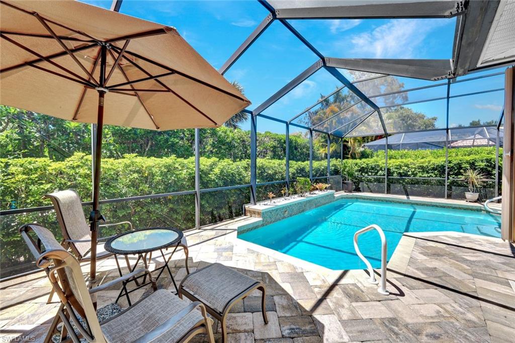 16208 Parque Lane Naples, FL 34110 - Photo 21 of 22 a view of swimming pool with a backyard