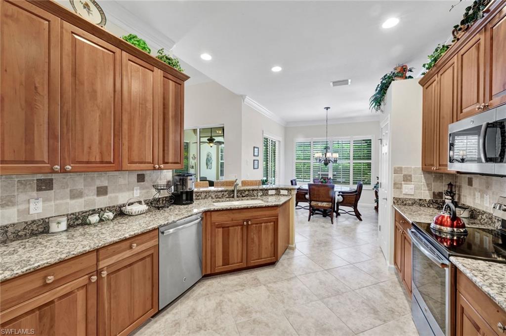 16208 Parque Lane Naples, FL 34110 - Photo 7 of 22 a kitchen with lots of counter top space