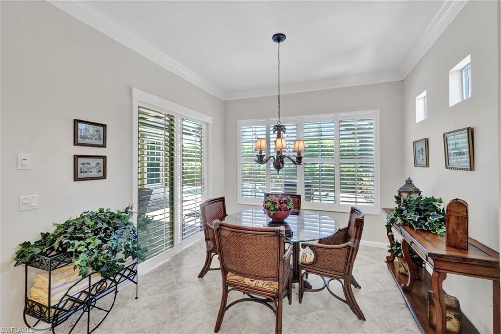 16208 Parque Lane Naples, FL 34110 - Photo 10 of 22 a view of a dining room with furniture window and wooden floor