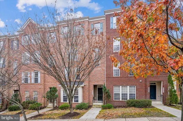 a front view of a building with a yard