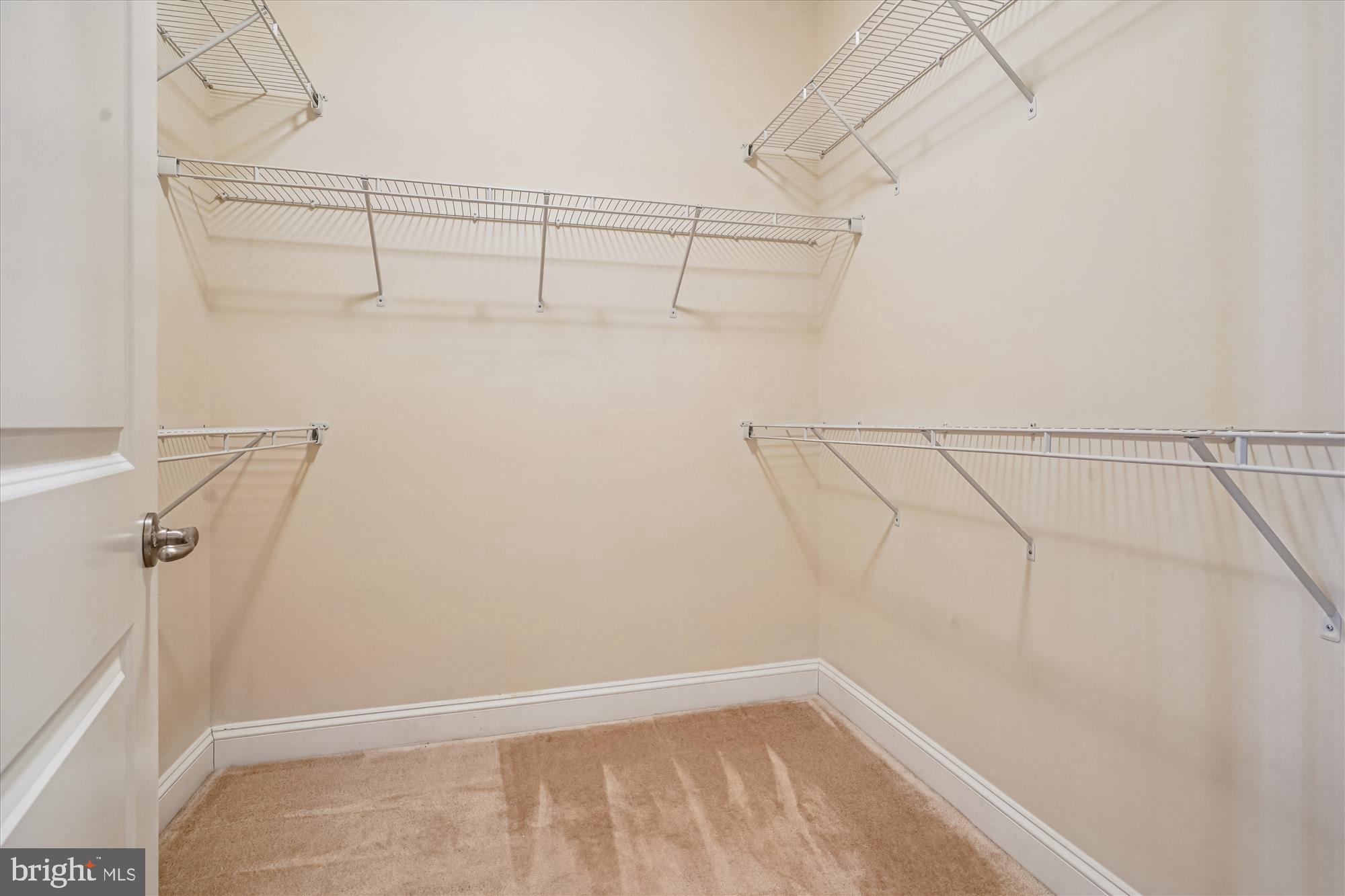 2675 Sheffield Hill Way, Unit 164 Woodbridge, VA 22191 - Photo 11 of 37 a view of a room with racks on the wall