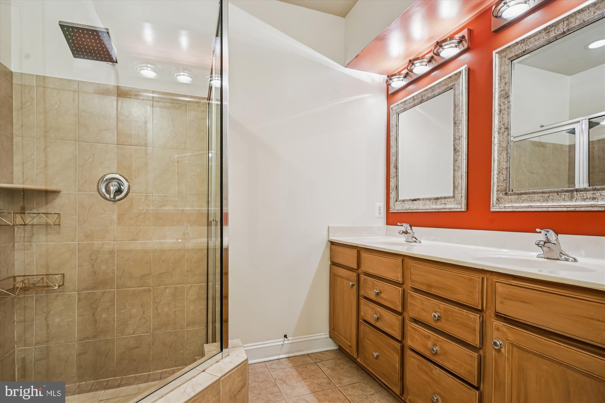 2675 Sheffield Hill Way, Unit 164 Woodbridge, VA 22191 - Photo 12 of 37 a bathroom with a double vanity sink mirror and shower