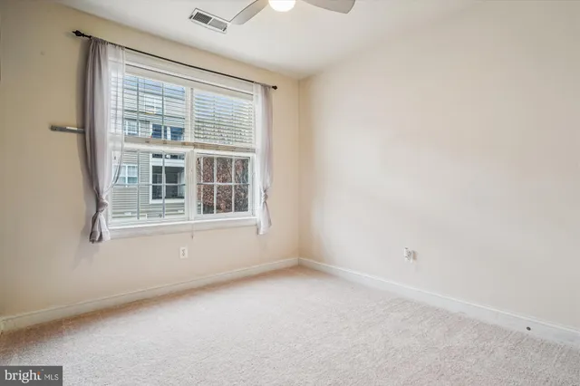 a view of empty room with windows