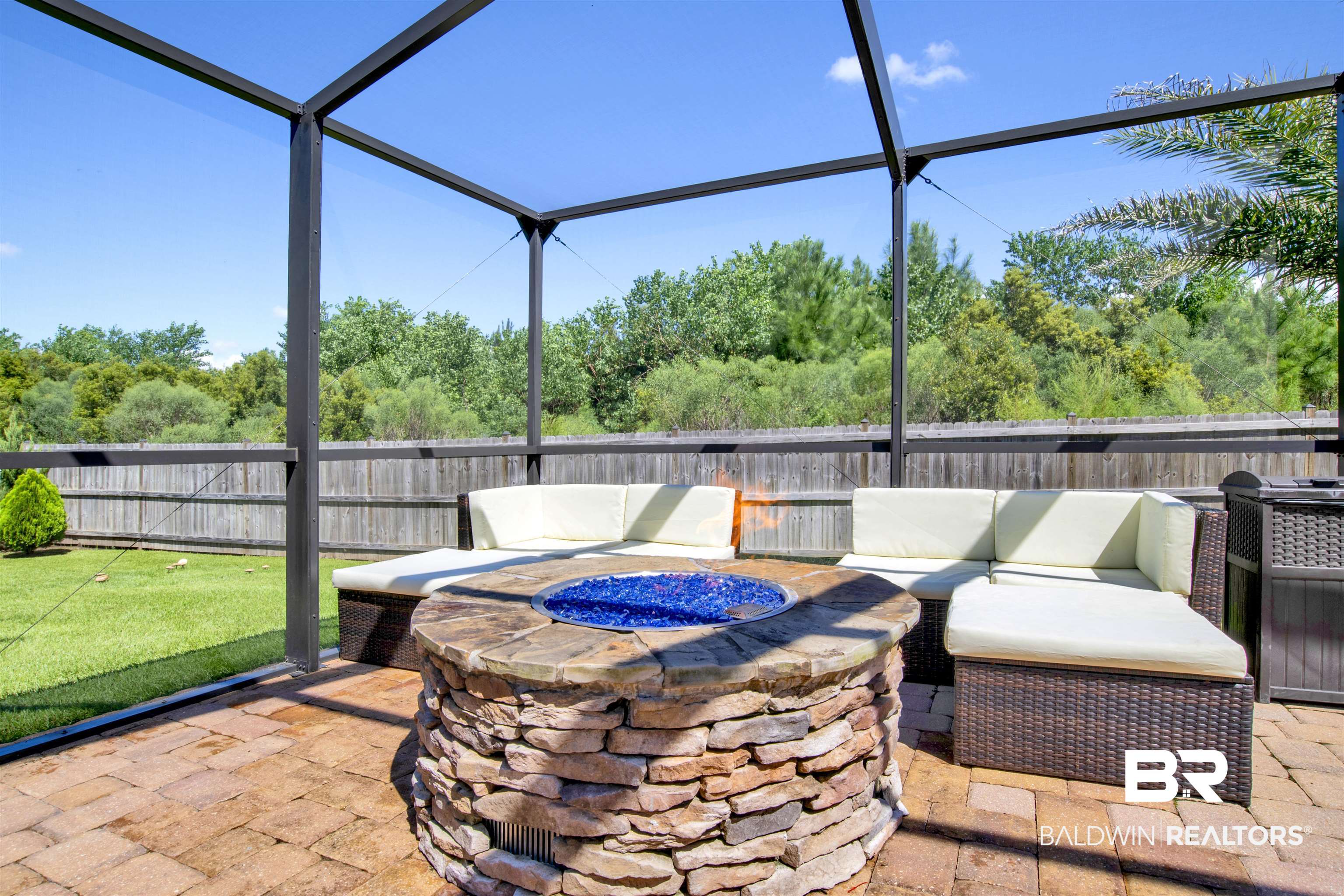 4196 Inverness Circle Gulf Shores, AL 36542 - Photo 37 of 43 View of patio with an outdoor fire pit and a lanai