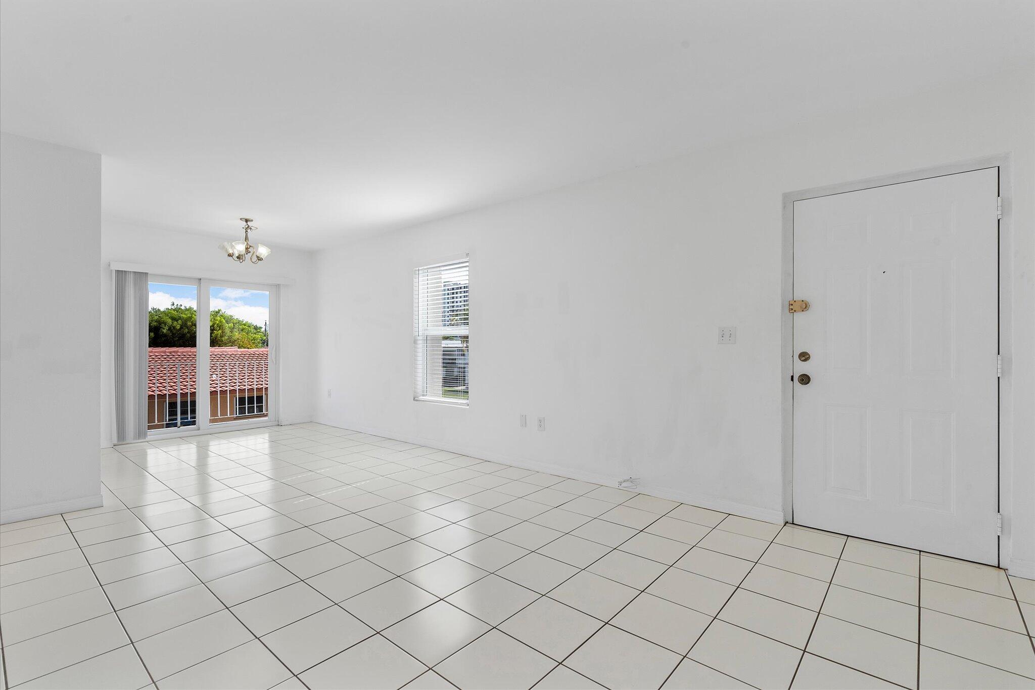 2138 Southwest 6th Street, Unit 301 Miami, FL 33135 - Photo 4 of 15 a view of an empty room and window