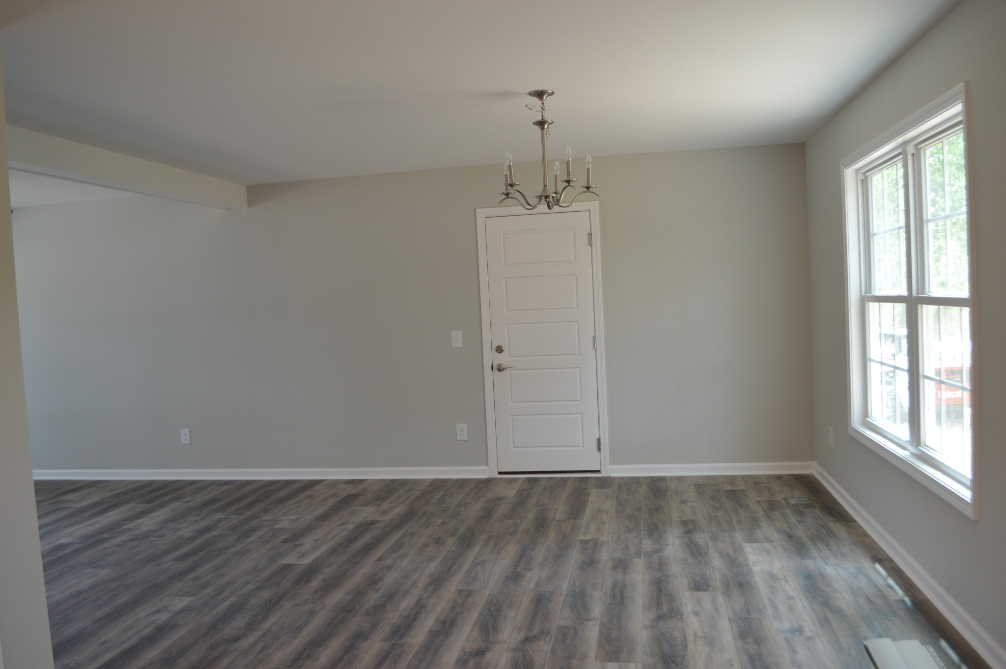 7713 South Swift Road Goodlettsville, TN 37072 - Photo 4 of 18 wooden floor in an empty room with a window