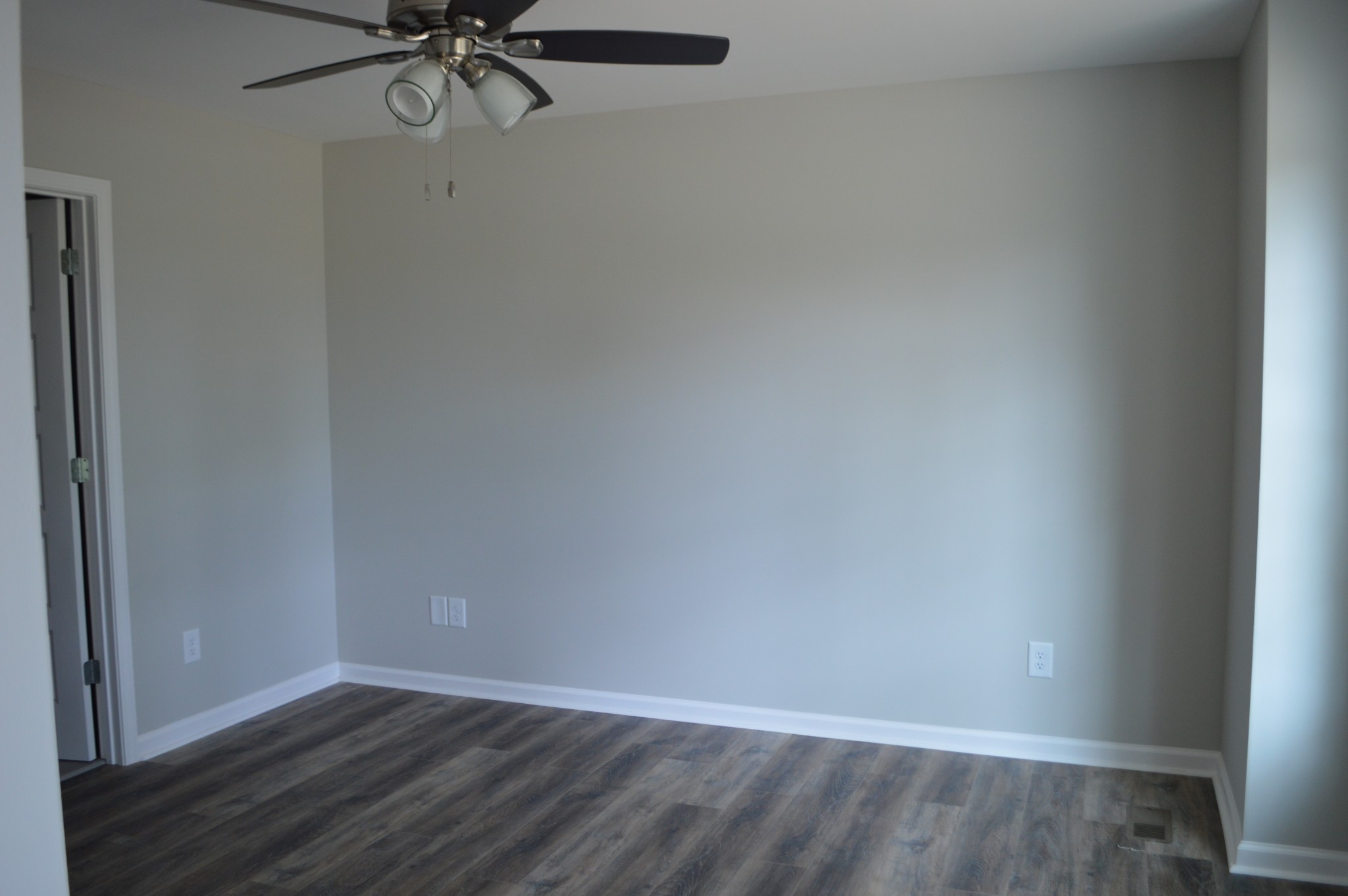 7713 South Swift Road Goodlettsville, TN 37072 - Photo 8 of 18 a view of a room with wooden floor and fan