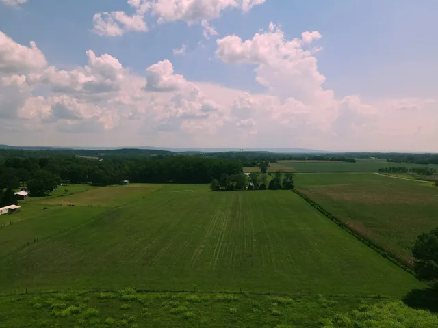 a view of a lake with a big yard
