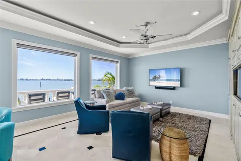 a kitchen with granite countertop a sink stainless steel appliances and cabinets
