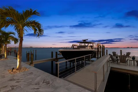 a bathroom with a tub shower and window