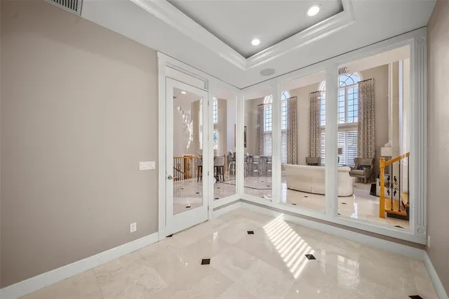 a view of a a dining room with furniture and window