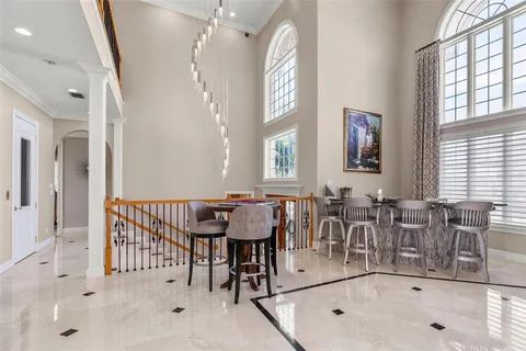 a spacious bedroom with a bed and large window