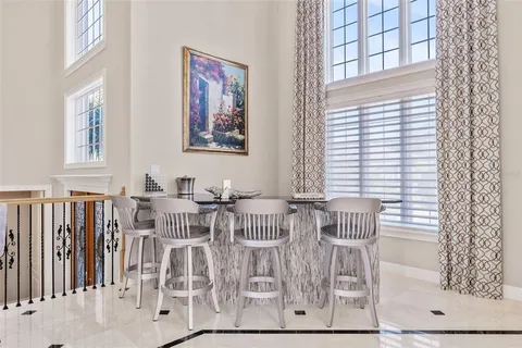 a spacious bedroom with a large bed and a large window