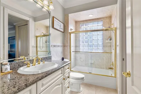 a view of a balcony with dining table & chairs