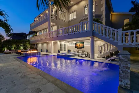 a view of a swimming pool with a table and chairs