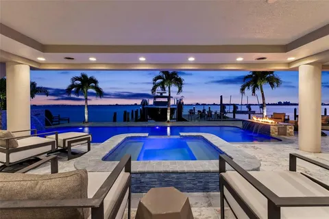 a view of a swimming pool with a patio