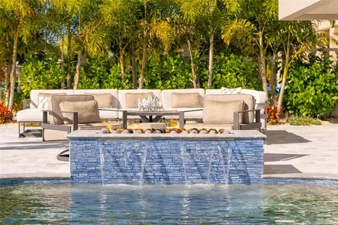 a kitchen with stainless steel appliances granite countertop a stove sink and microwave