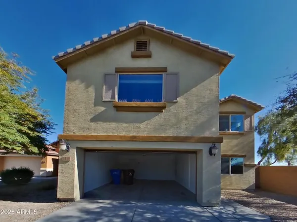 a front view of a house with garage