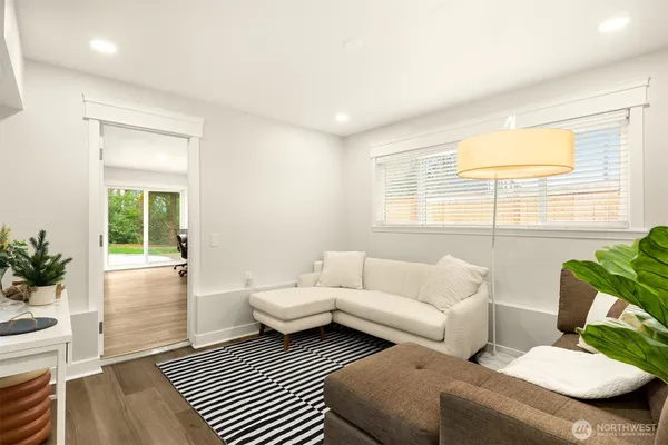 a living room with furniture and a window