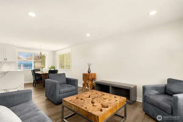 a living room with furniture and a rug