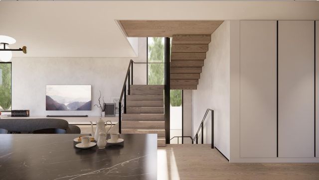 a view of hall way with furniture and entryway