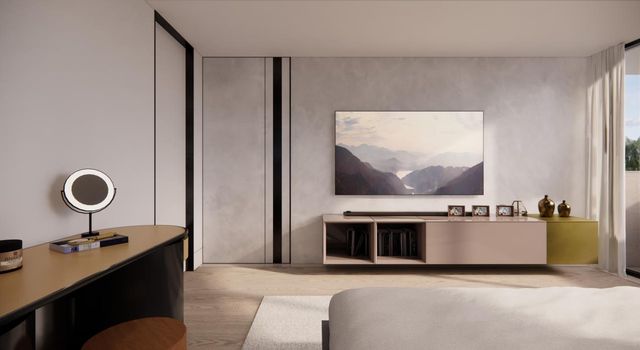 a bedroom with a bed and a flat screen tv