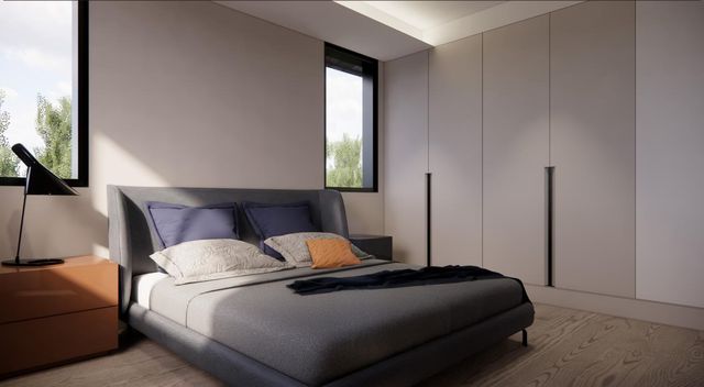 a bedroom with a bed and a mirror