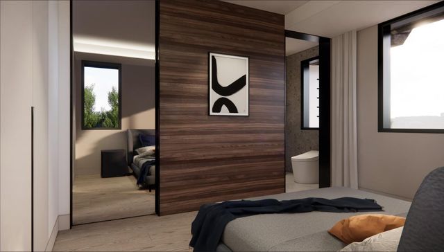 a bedroom with a large bed and a window