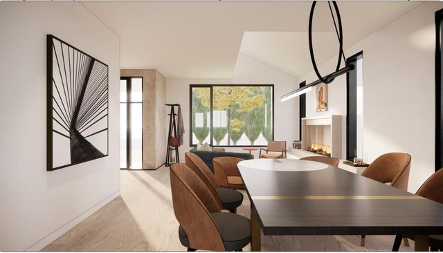 a dining room with furniture and a window