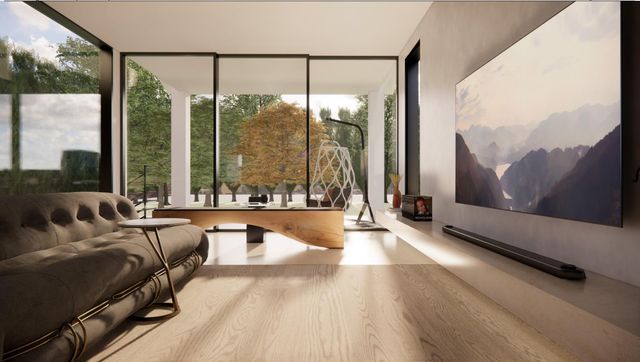 a living room with couch and a large window