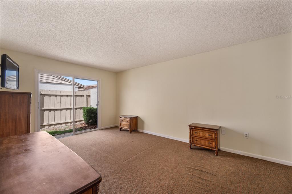 4231 Oak Loop, Unit 51 Mulberry, FL 33860 - Photo 17 of 29 a view of an empty room with a window