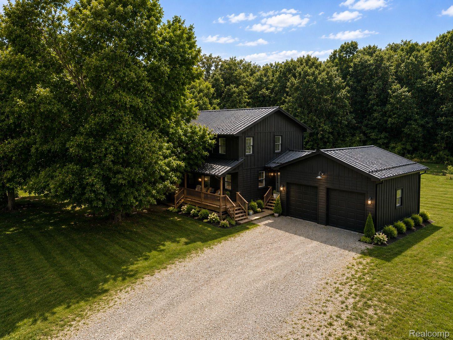 76565 McFadden Road Armada, MI 48005 - Photo 77 of 95 Black board-and-batten exterior with a metal roof