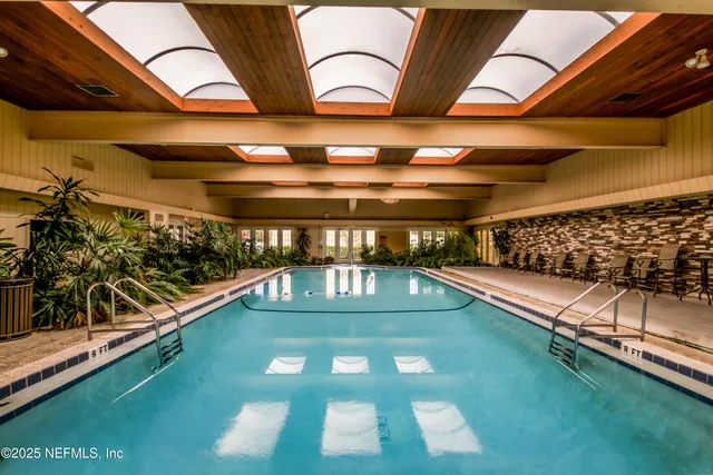 a view of swimming pool with a yard