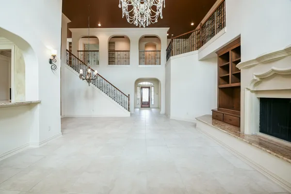 a view of empty room with a fireplace