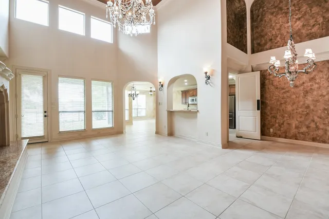 a kitchen with stainless steel appliances kitchen island granite countertop a sink and cabinets