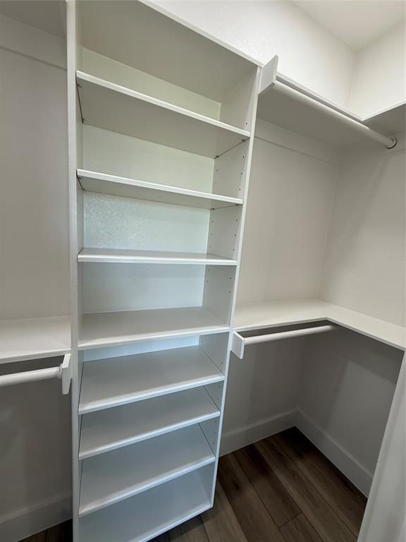 413 North Cleburne Whitney Road Rio Vista, TX 76093 - Photo 14 of 20 Built-in closet system featuring multiple white shelving units and hanging rods