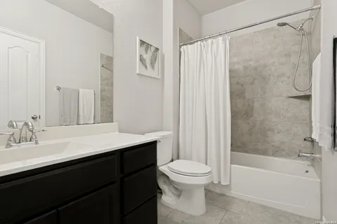 a bathroom with a sink a toilet and a bathtub