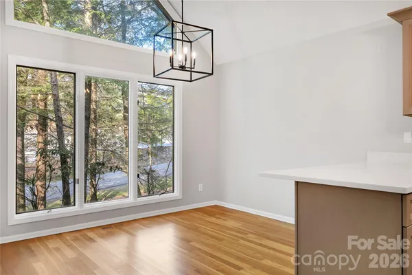 a kitchen with stainless steel appliances a sink cabinets and a counter top space