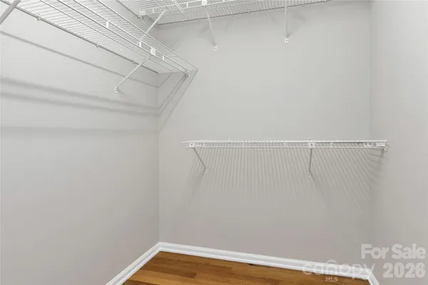 a white toilet sitting next to a bath tub
