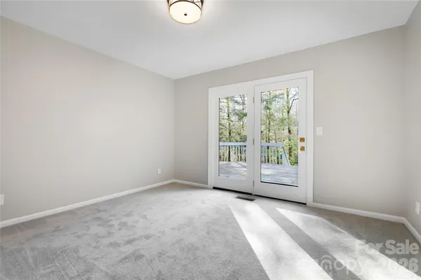a spacious bathroom with a double vanity sink a toilet and a window