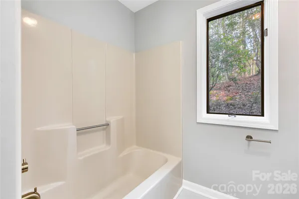 a bathroom with a sink a mirror and a toilet