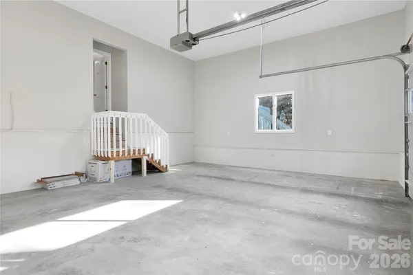 a view of a bedroom with wooden floor