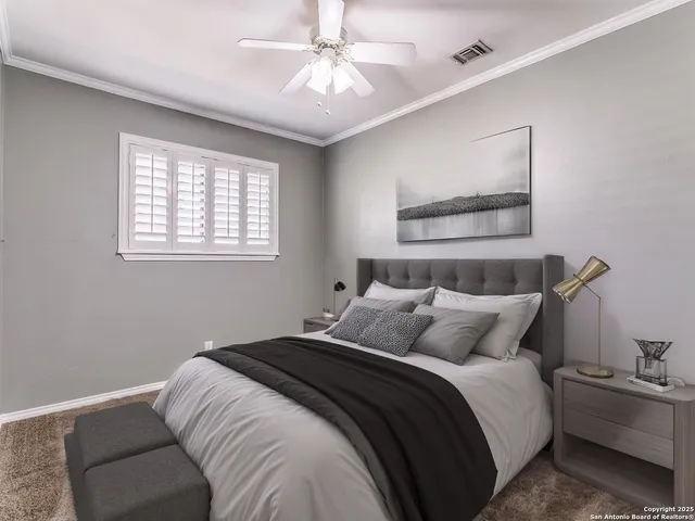 a bedroom with bed and a window