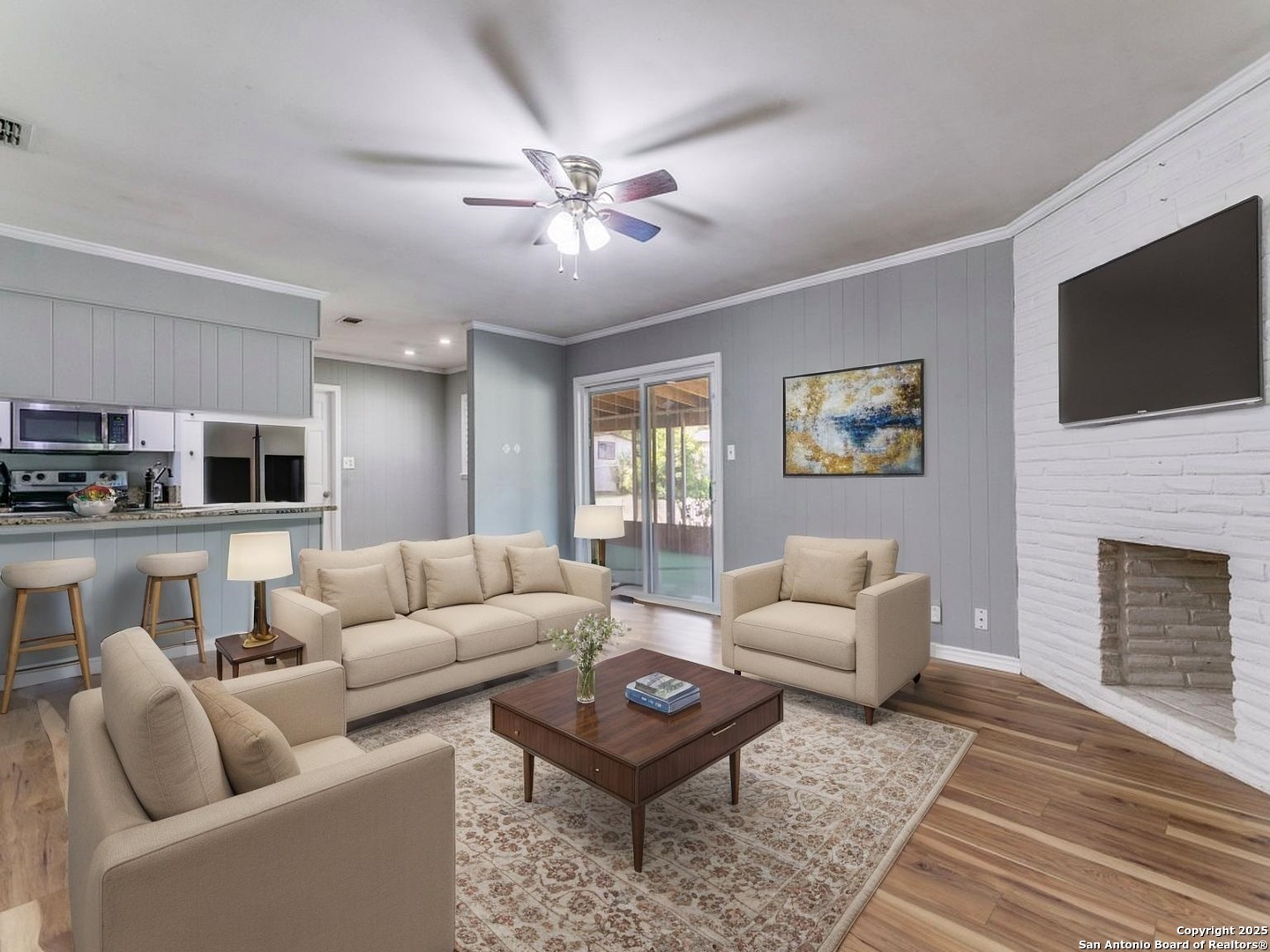 249 Ralston Drive Converse, TX 78109 - Photo 10 of 25 a living room with furniture a rug and a fireplace
