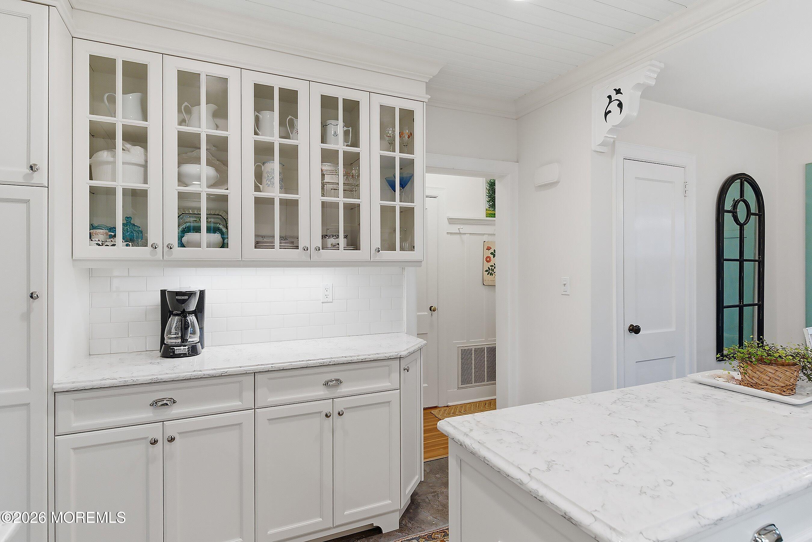 607 Cherokee Lane Brielle, NJ 08730 - Photo 22 of 64 a kitchen with a refrigerator and cabinets