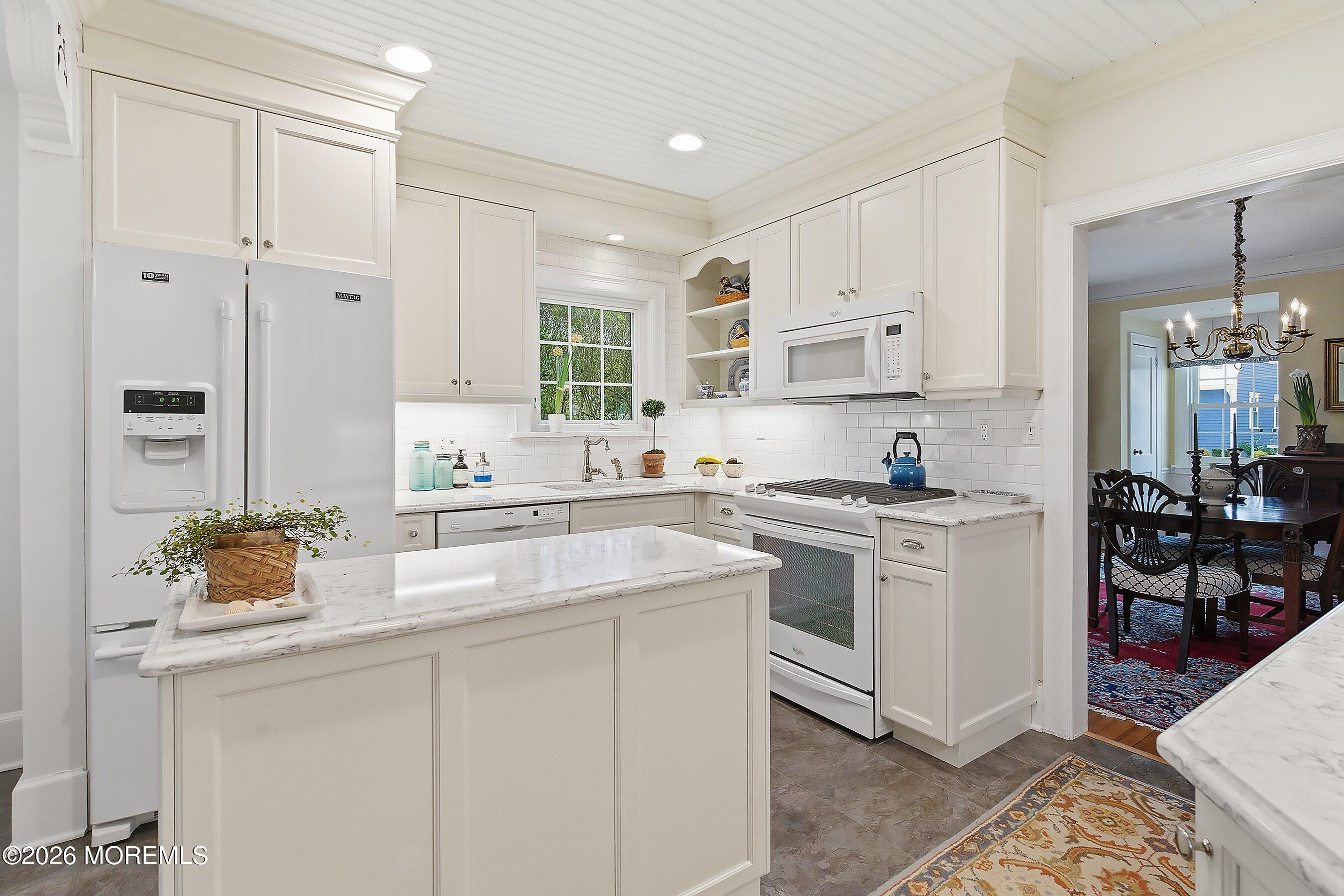 607 Cherokee Lane Brielle, NJ 08730 - Photo 23 of 64 a kitchen with stainless steel appliances granite countertop a sink and cabinets