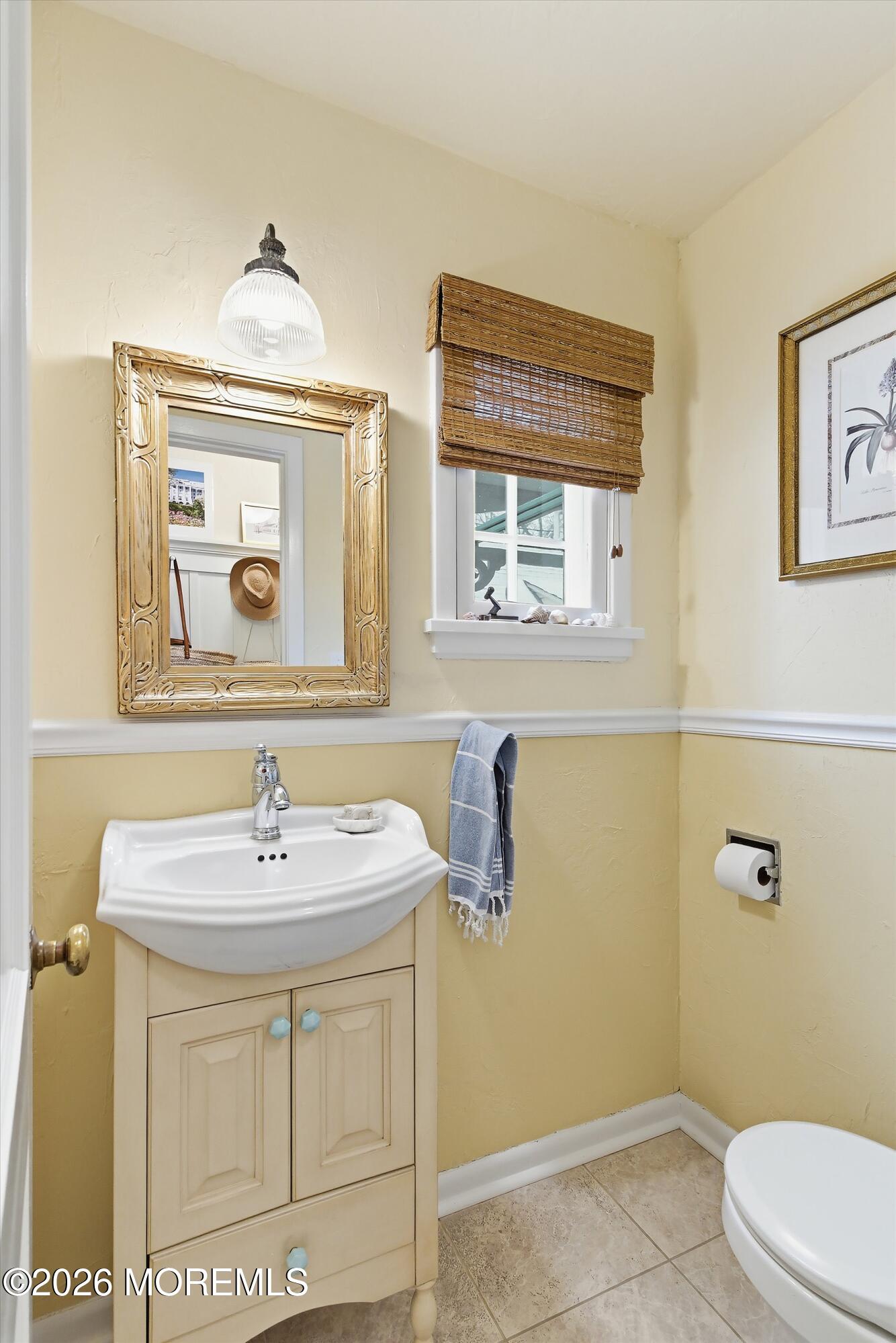 607 Cherokee Lane Brielle, NJ 08730 - Photo 30 of 64 a bathroom with a sink a toilet and mirror