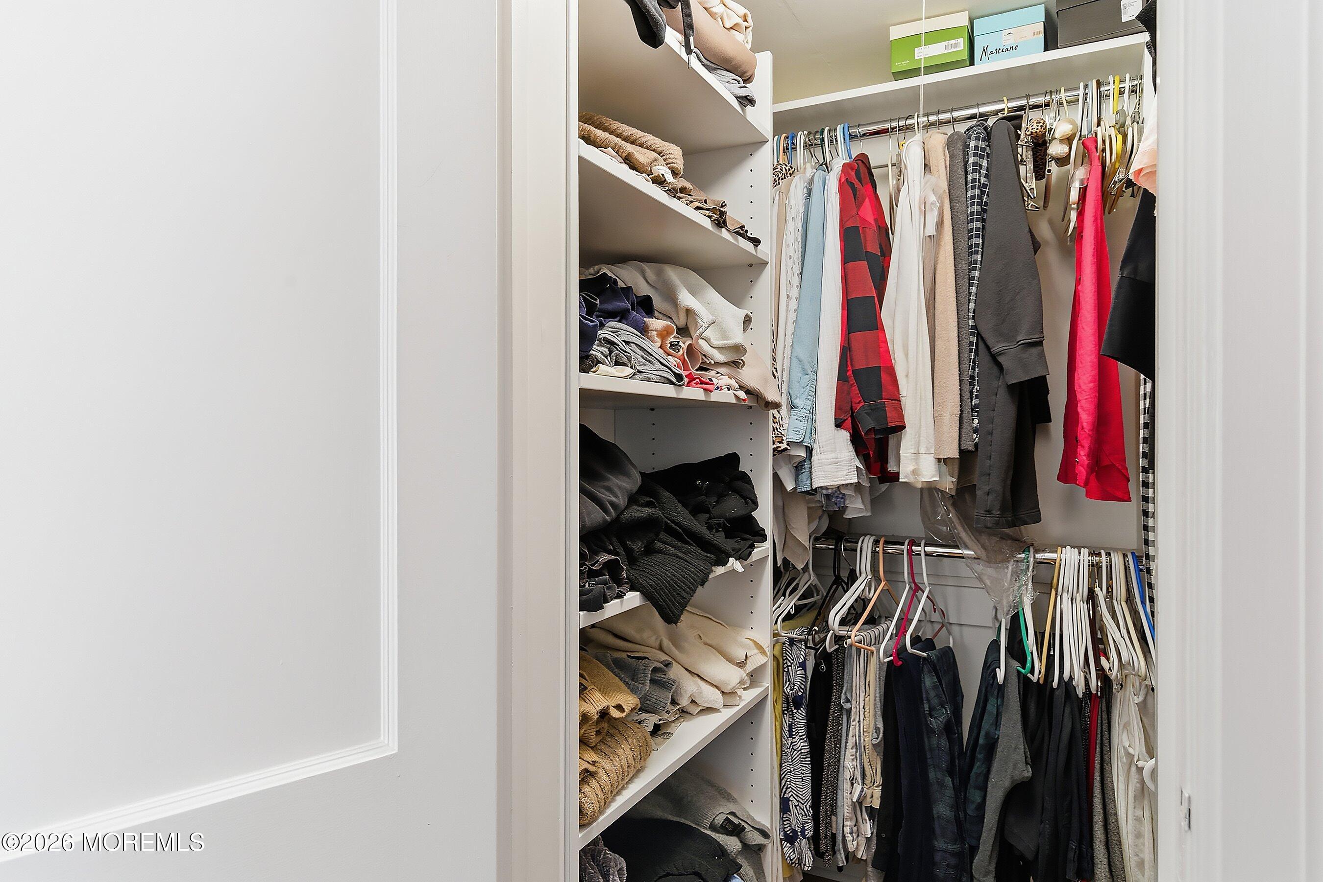 607 Cherokee Lane Brielle, NJ 08730 - Photo 34 of 64 a view of walk in closet with clothes
