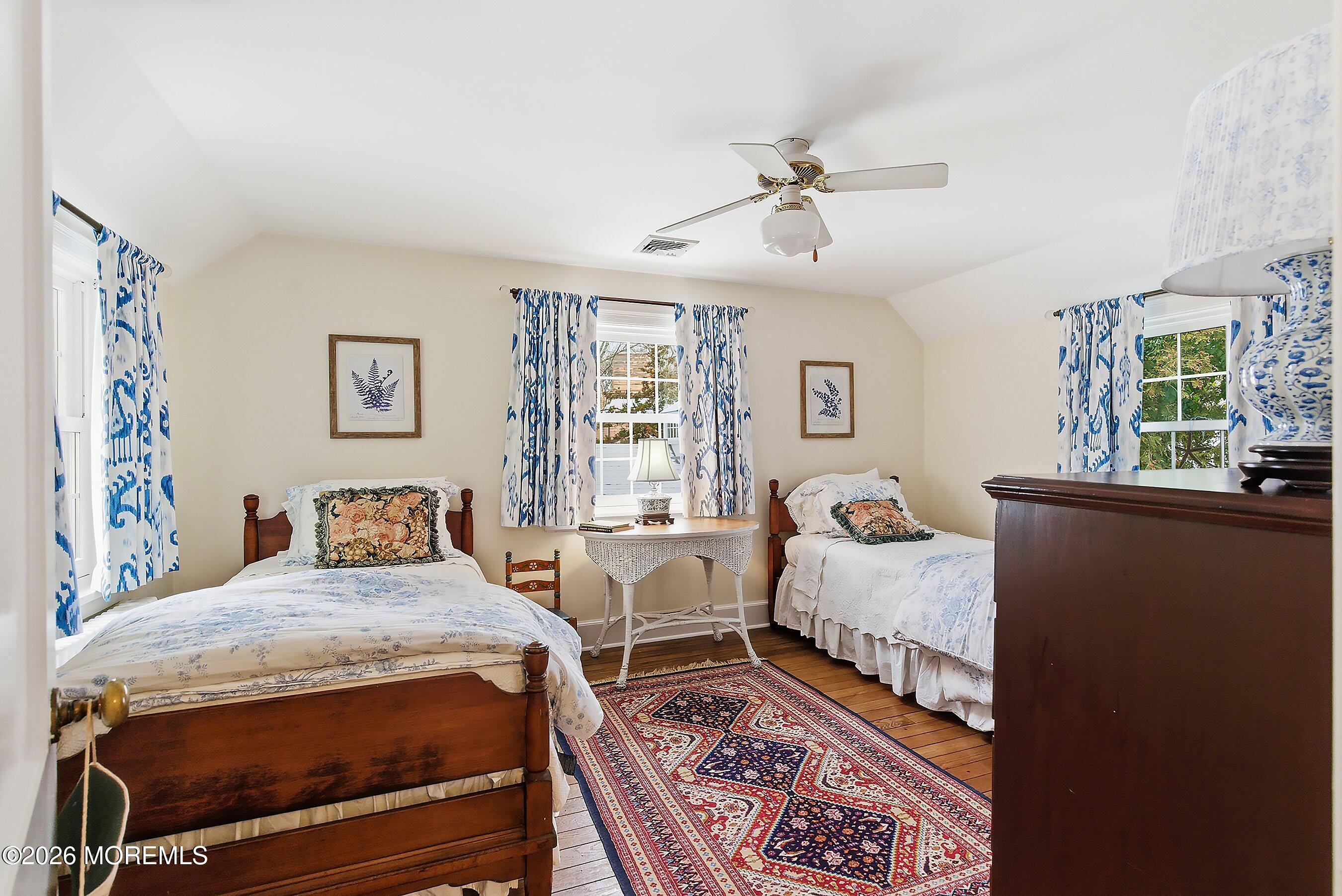 607 Cherokee Lane Brielle, NJ 08730 - Photo 43 of 64 a bedroom with a bed and wooden floor