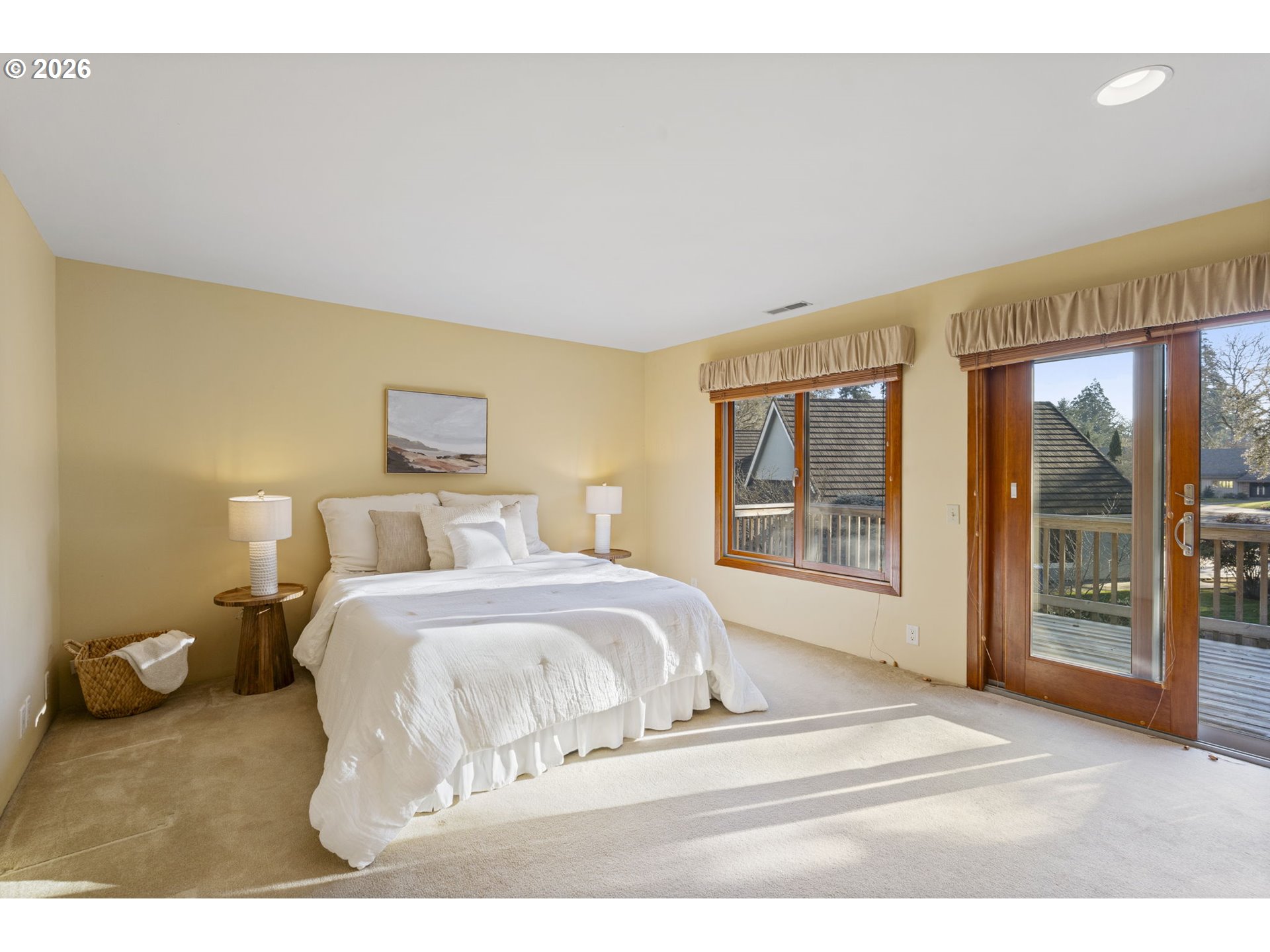 847 Fairway View Drive Eugene, OR 97401 - Photo 13 of 28 a bedroom with a large bed and a large window